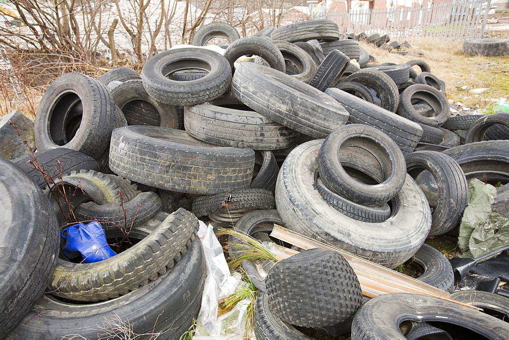 Tyres dumped on waste ground in Keighley, West Yorkshire, Yorkshire, England, United Kingdom, Europe