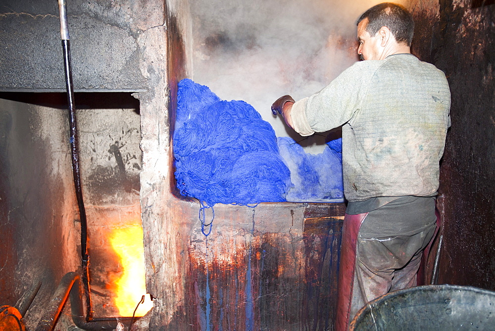 A man dyeing cloth in the dyers souk in Marrakech, Morocco, North Africa, Africa