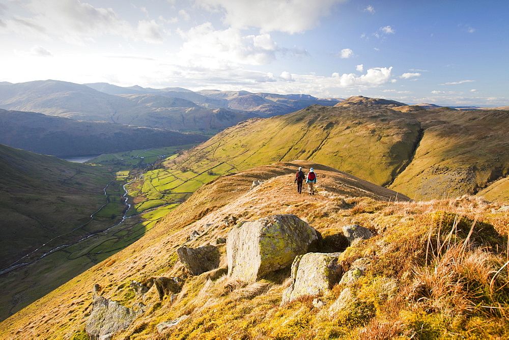 Women walkers descend Gray Crag towards Hartsop in the Lake District, Cumbria, England, United Kingdom, Europe