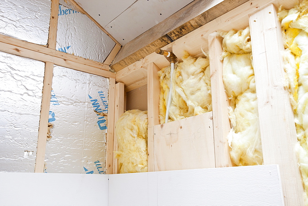 Insulation in the stud walls of one of the bathrooms at the Hyning in Grayrigg, an old farmhouse and barns being converted into eight holiday letting properties, near Kendal, Cumbria, England, United Kingdom, Europe