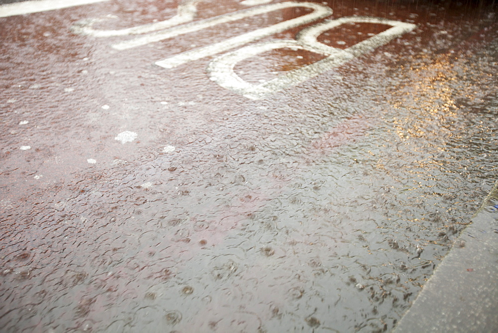 Runoff from a torrential downpour on the streets of Kings Cross, London, England, United Kingdom, Europe