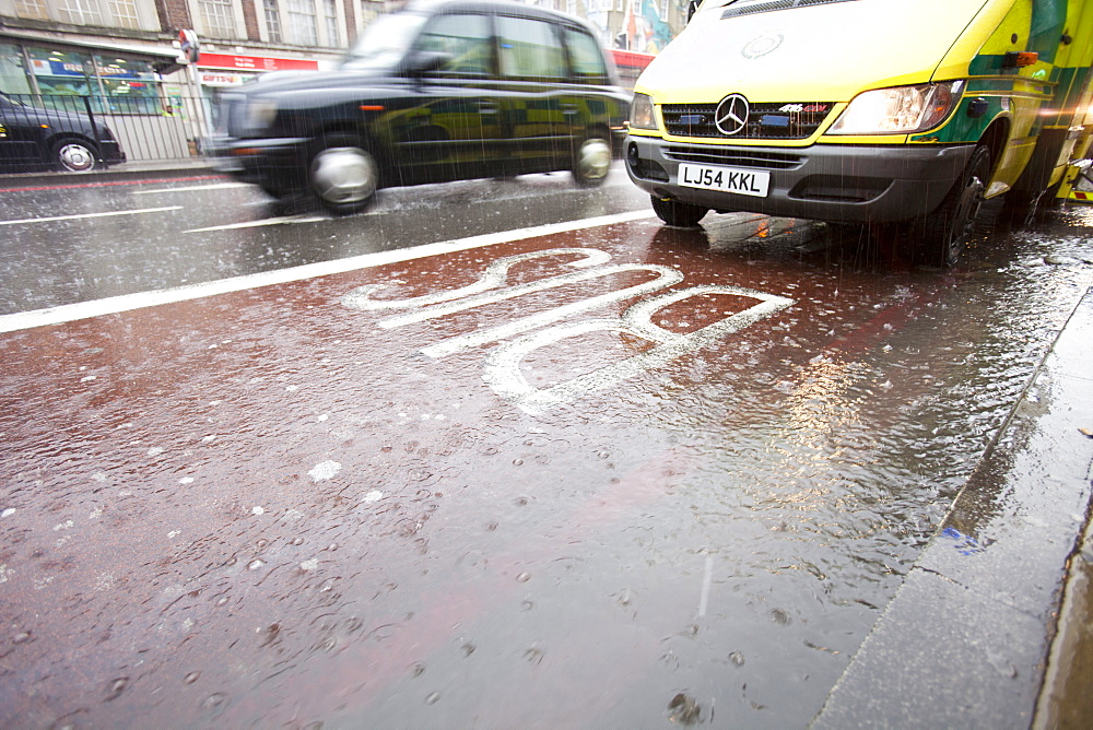 Runoff from a torrential downpour on the streets of Kings Cross, London, England, United Kingdom, Europe