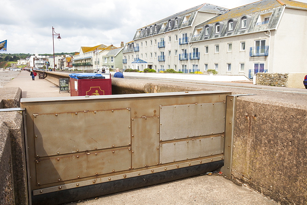 A storm surge steel gate closed following a bad storm in Seaton, to protect the town against flooding, Devon, England, United Kingdom, Europe