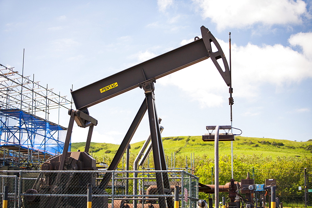 A nodding donkey oil pump at Kimmeridge Bay, Dorset, England, United Kingdom, Europe