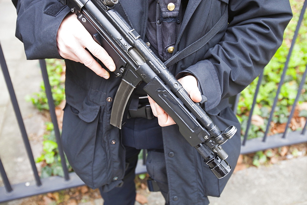 Armed police officer protecting the American Embassy in Grosvenor Square, London, England, United Kingdom, Europe