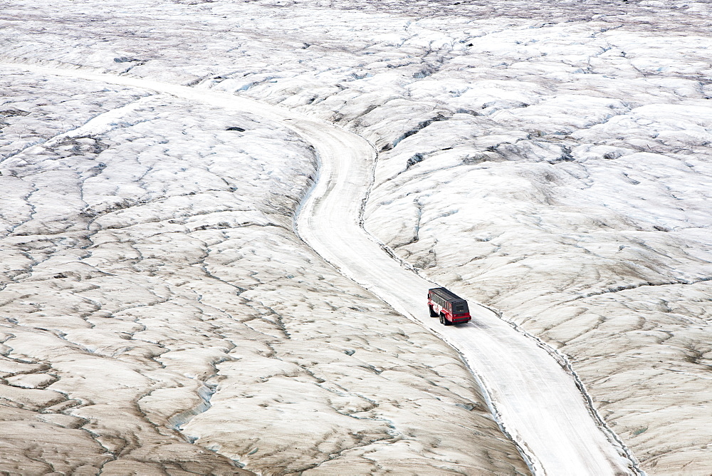 Tourist ice buggy on the Athabasca Glacier, Jasper National Park, UNESCO World Heritage Site, Alberta, Canadian Rockies, Canada, North America