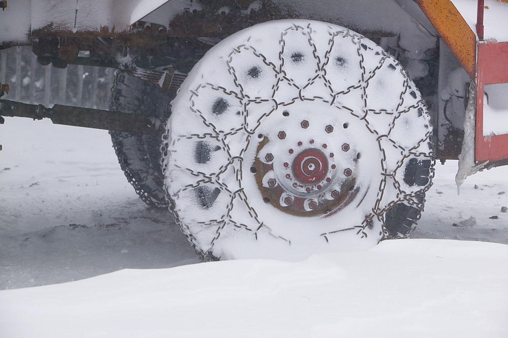 A snow plough in a blizzard at the Cairngorm Ski Resort which was closed due to stormy weather, Scotland, United Kingdom, Europe