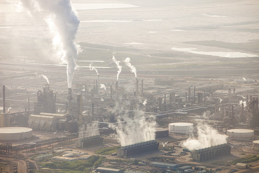 Hideous air pollution from the Syncrude Tar sands upgrader plant north of Fort McMurray, Alberta, Canada, North America