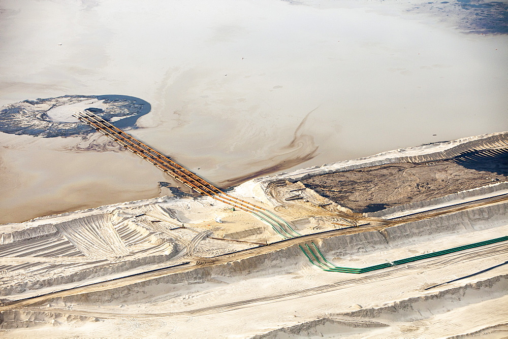 The tailings pond at the Syncrude mine north of Fort McMurray, Alberta, Canada, North America