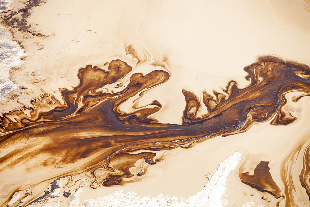 The tailings pond at the Syncrude mine north of Fort McMurray, Alberta, Canada, North America