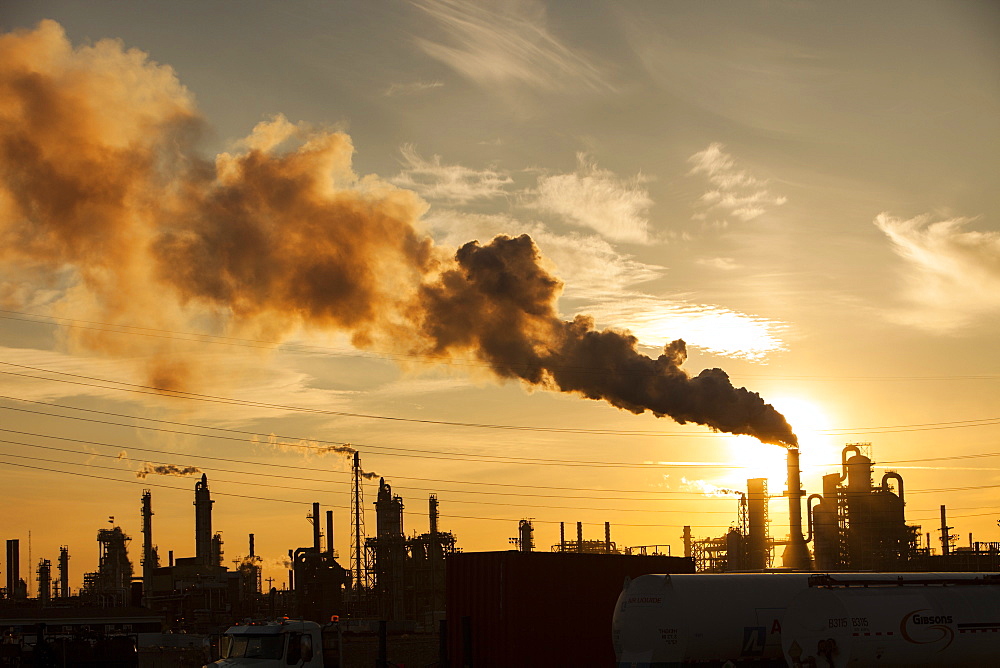 The tar sands upgrader plant at the Syncrude mine north of Fort McMurray at sunset, Alberta, Canada, North America