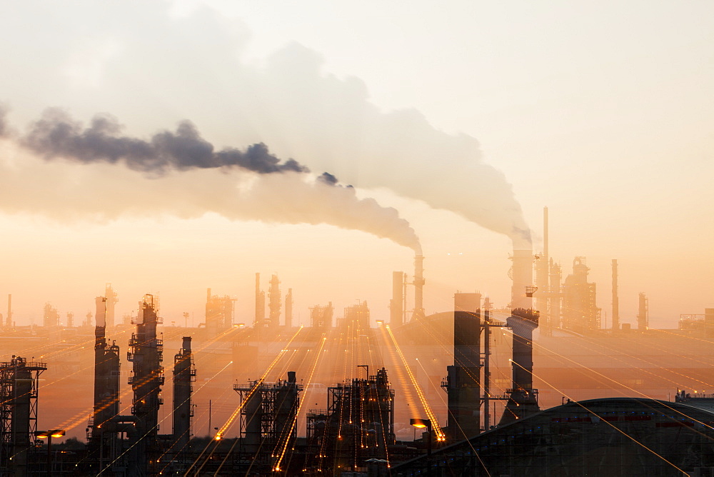 The tar sands upgrader plant at the Syncrude mine north of Fort McMurray at sunset, Alberta, Canada, North America