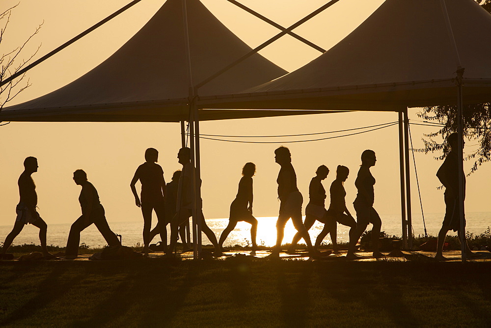 A stretch and relax class at sunset at a holiday complex in Myrina on Lemnos, Greek Islands, Greece, Europe