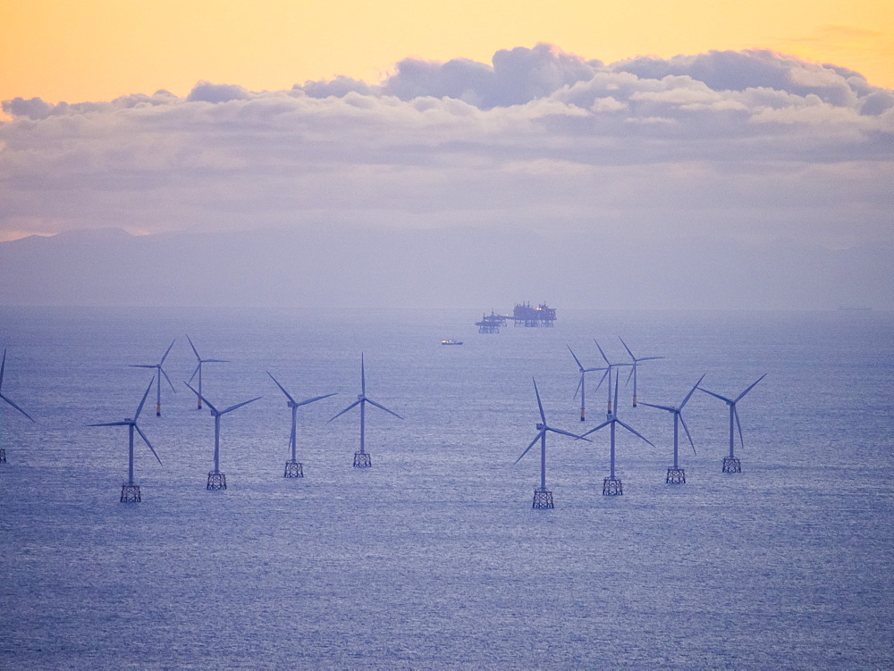 An Irish Sea gas platform and wind turbines in the Irish Sea from Black Coombe in the Lake District, Cumbria, England, United Kingdom, Europe