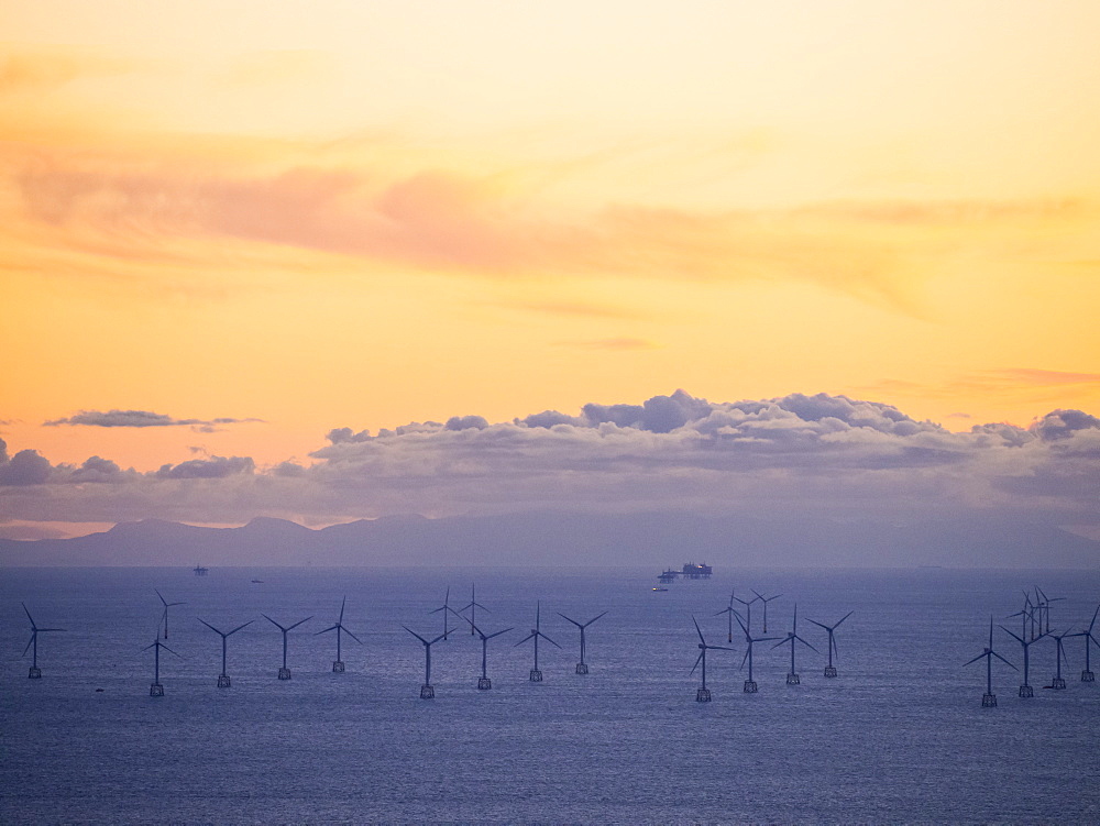 An Irish Sea gas platform and wind turbines in the Irish Sea from Black Coombe in the Lake District, Cumbria, England, United Kingdom, Europe