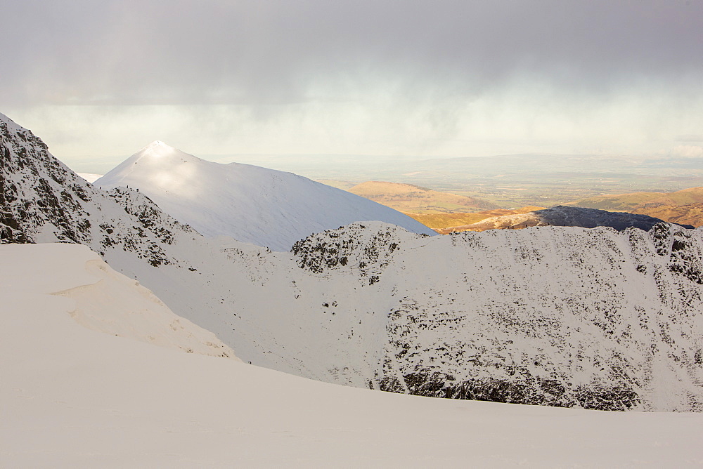 Climbers on Striding Edge on Helvellyn, looking towards Catstycam in the Lake District National Park, Cumbria, England, United Kingdom, Europe