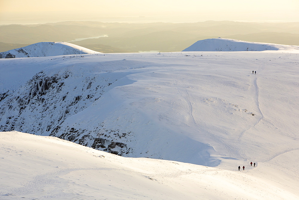 Walkers on Helvellyn in the snow, Lake District National Park, Cumbria, England, United Kingdom, Europe