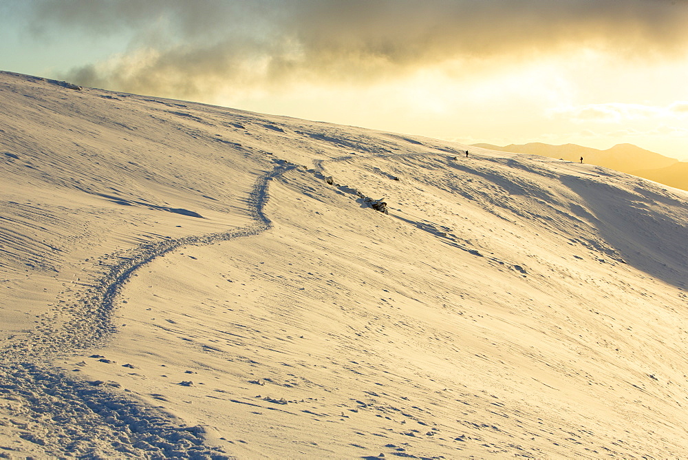 Walkers on Helvellyn in the snow, Lake District National Park, Cumbria, England, United Kingdom, Europe