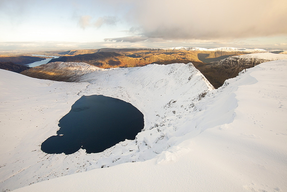 The summit plateau of Helvellyn looking down towards Red Tarn and Striding Edge, Lake District National Park, Cumbria, England, United Kingdom, Europe