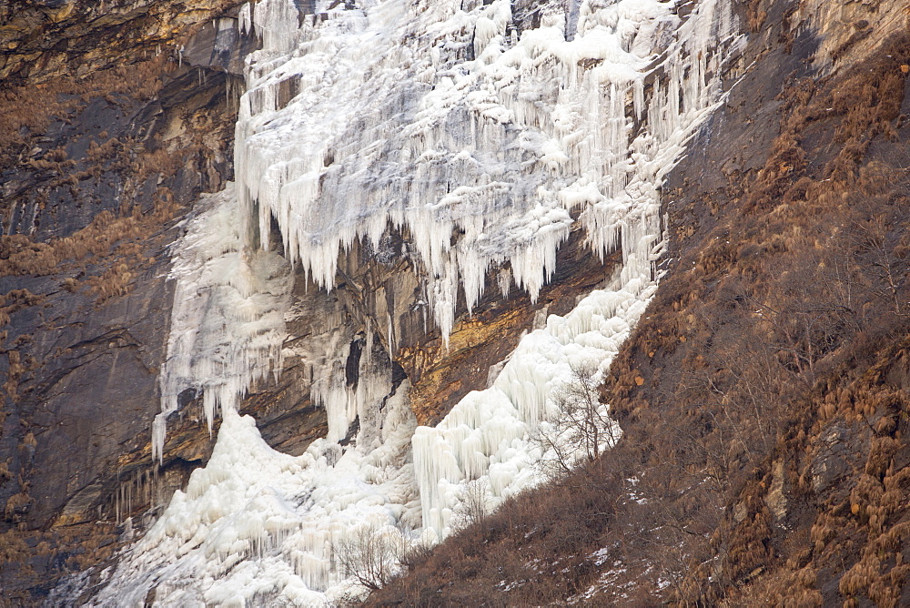 A frozen waterfall on the lower slopes of Machapuchare (Fish Tail Peak) in the Annapurna Himalayas, Nepal, Asia