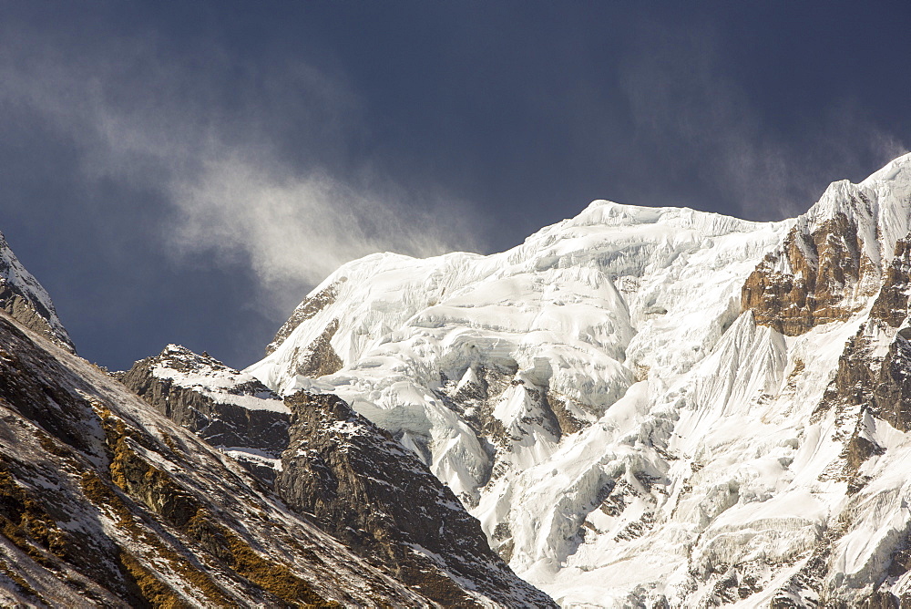 Annapurna South summit with high winds pushing spindrift off the summit, Annapurna Sanctuary, Himalayas, Nepal, Asia