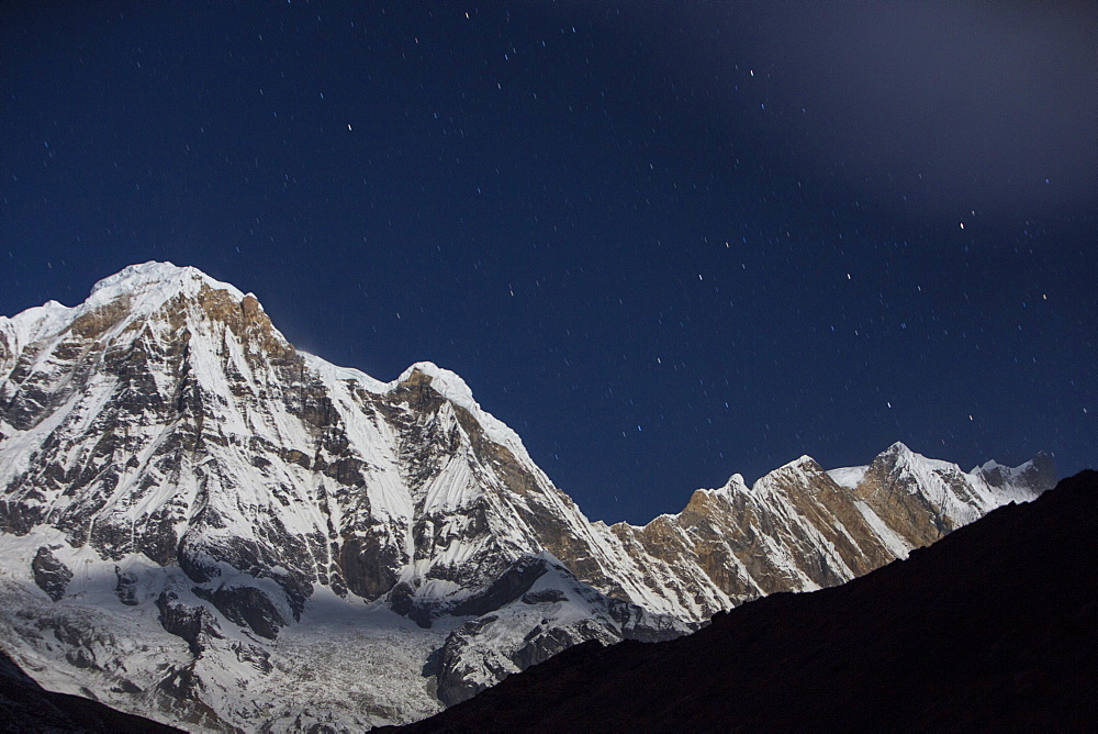 The night sky over Annapurna South and Annapurna Fang in the Annapurna Sanctuary, Himalayas, Nepal, Asia