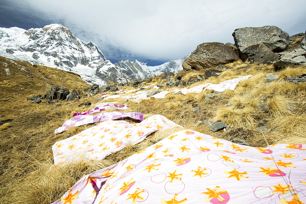 Sheets from the tea house lodge drying at Annapurna Base Camp at 4130 metres in front of Annapurna South summit, Annapurna Sanctuary, Himalayas, Nepal, Asia