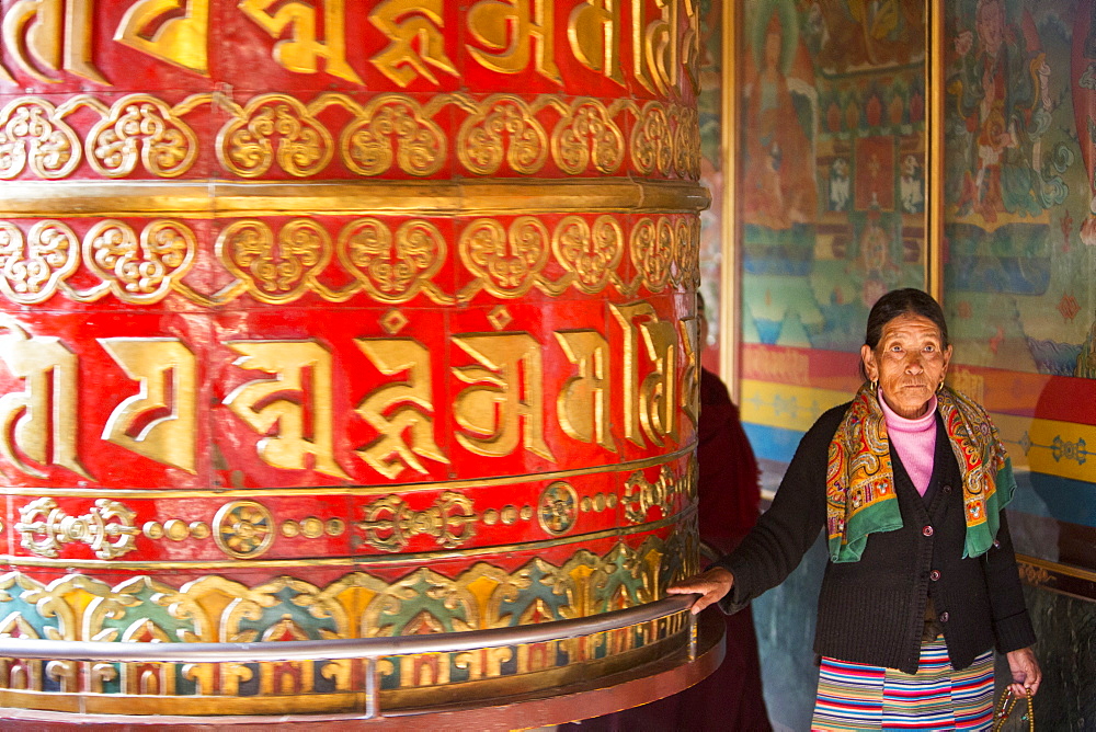 A massive prayer wheel at the Boudhanath Stupa, one of the holiest Buddhist sites in Kathmandu, Nepal, Asia