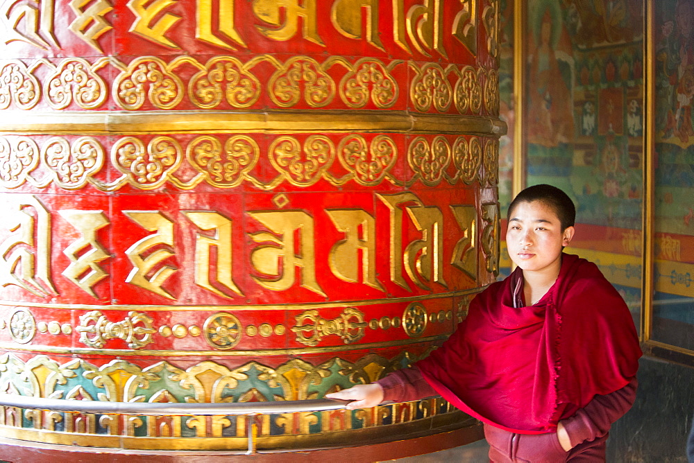 A massive prayer wheel at the Boudhanath Stupa, one of the holiest Buddhist sites in Kathmandu, Nepal, Asia