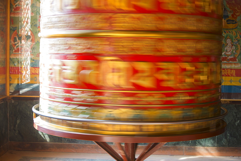 A massive prayer wheel at the Boudhanath Stupa, one of the holiest Buddhist sites in Kathmandu, Nepal, Asia