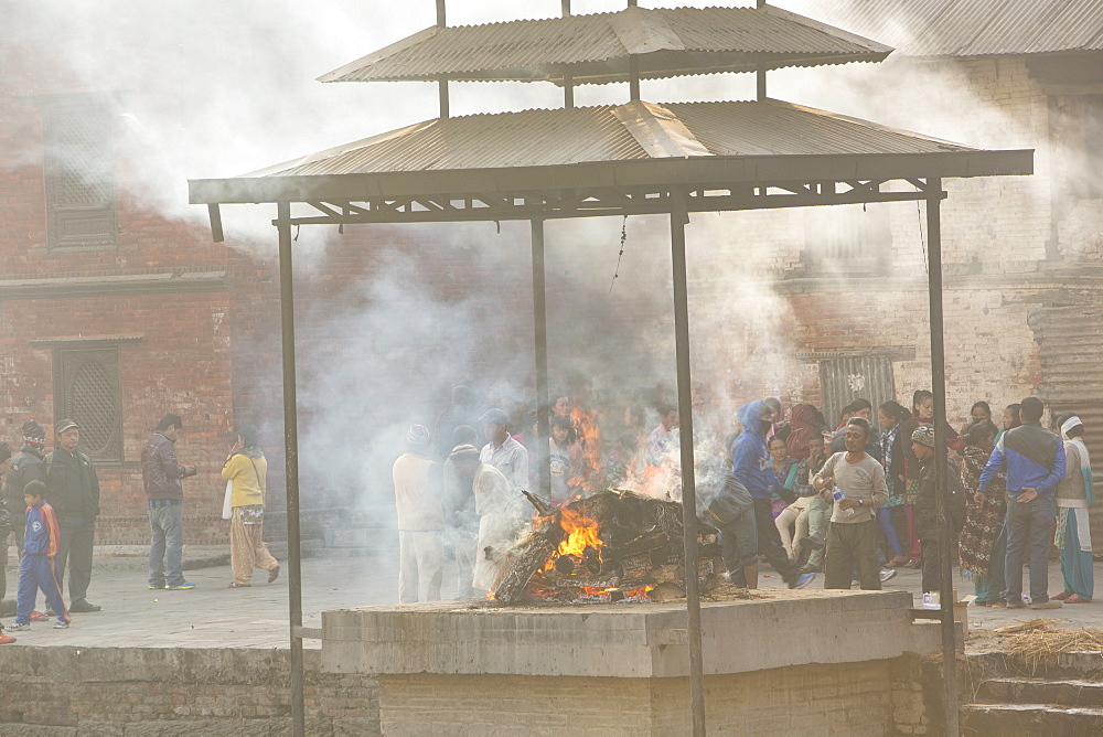 A cremation at the Pashupatinath Temple, a Hindu temple of Lord Shiva on the banks of the Bagmati River, UNESCO World Heritage Site, Kathmandu, Nepal, Asia