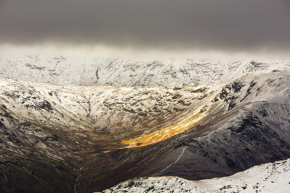 Looking through to Greenburn from Fairfield in misty weather with drifting snow in high winds, Lake District National Park, Cumbria, England, United Kingdom, Europe