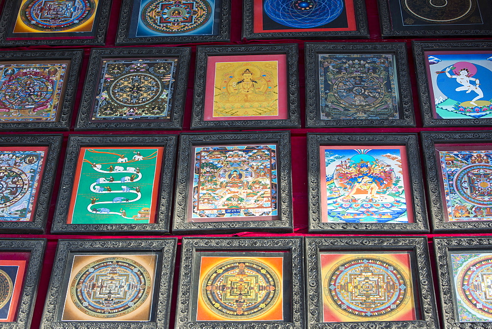 A shop selling traditional Buddhist Thanka paintings in Boudhanath Stupa square, Kathmandu, Nepal, Asia