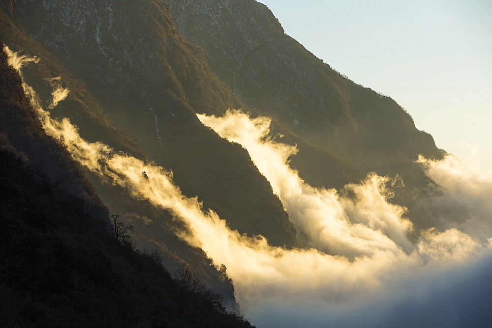 Mist moving up the Modi Khola valley in the Annapurna Sanctuary, in the Nepal Himalayas, Nepal, Asia