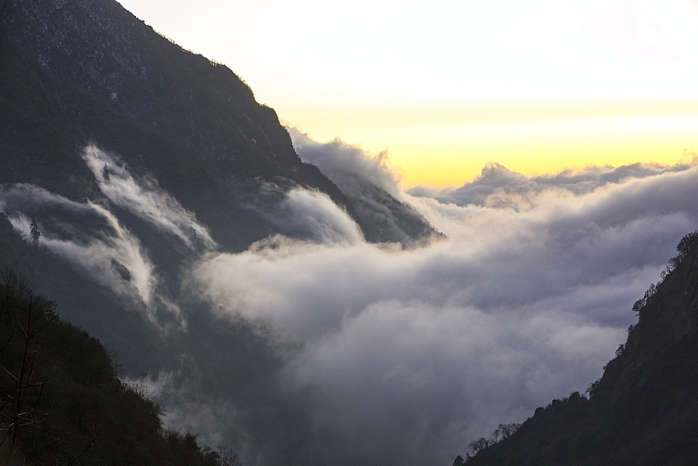 Mist moving up the Modi Khola valley in the Annapurna Sanctuary, in the Nepal Himalayas, Nepal, Asia