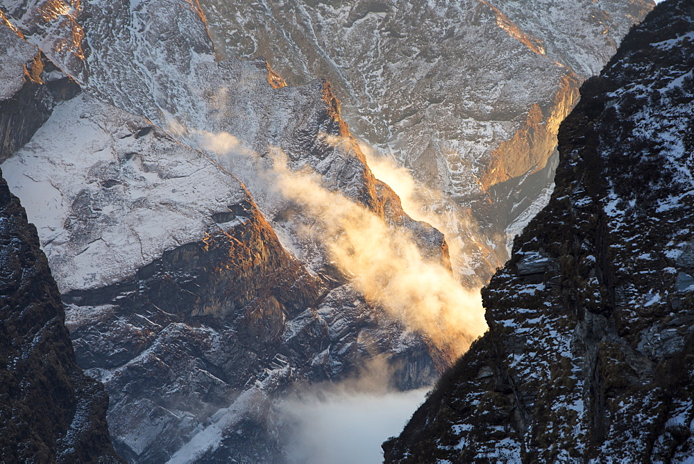 Mist moving up the Modi Khola valley in the Annapurna Sanctuary, Himalayas, Nepal, Asia