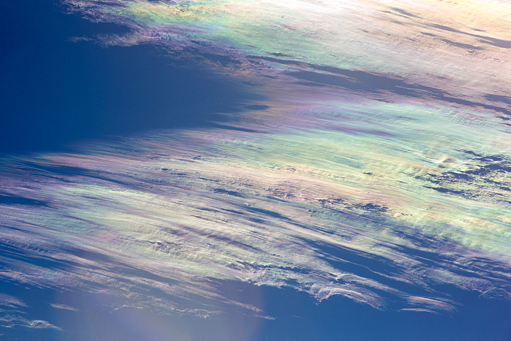 Jet stream winds over the Annapurna Himalayas with rainbow colours caused by refraction on ice crystals in the clouds, known as parhelion or sundog, Nepal, Asia