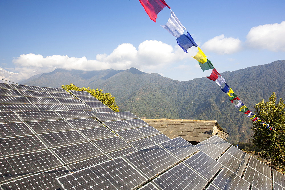 Solar photo voltaic panels being used to power a mobile phone mast at Ghandruk, Himalayas, Nepal, Asia