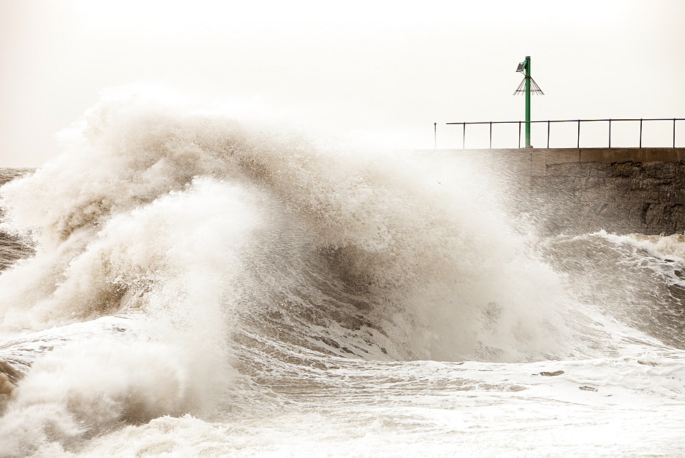 Gale force winds and crashing waves battering the coastal defences in Harrington, Workington, Cumbria, England, United Kingdom, Europe