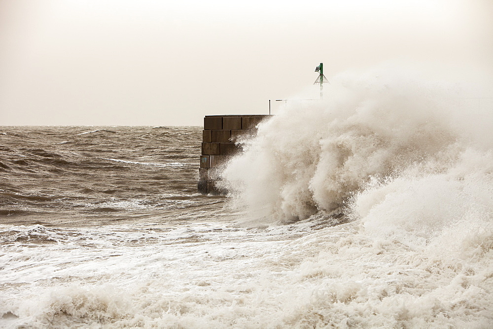 Gale force winds and crashing waves battering the coastal defences in Harrington, Workington, Cumbria, England, United Kingdom, Europe