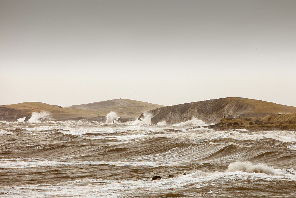 Gale force winds and crashing waves battering the coastal defences in Harrington, Workington, Cumbria, England, United Kingdom, Europe