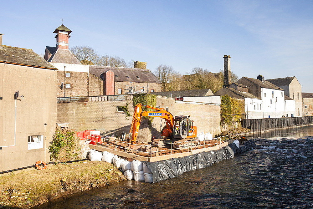 Constructing flood defences on the River Cocker in Cockermouth, Cumbria, England, United Kingdom, Europe