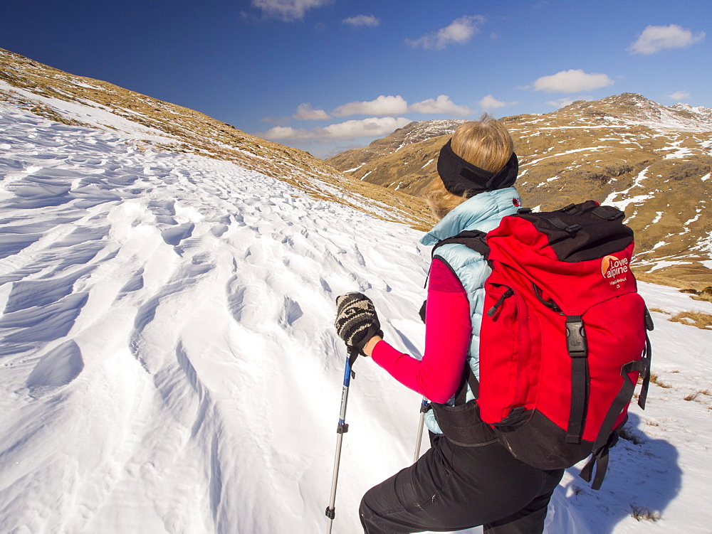 Snow shaped and scoured by a strong wind when it fell, above Wrynose Pass in the Lake District, Cumbria, England, United Kingdom, Europe