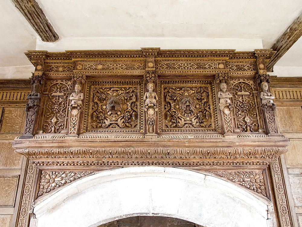 Intricate wood carving above the fire place in Stokesay Castle, a fortified manor house built in the late 13th century, in Stokesay, near Craven Arms, Shropshire, England, United Kingdom, Europe