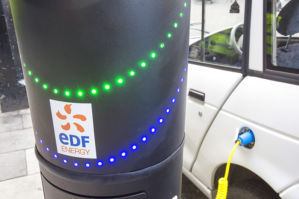 A G Wizz electric car at a pavement recharging station in London, England, United Kingdom, Europe