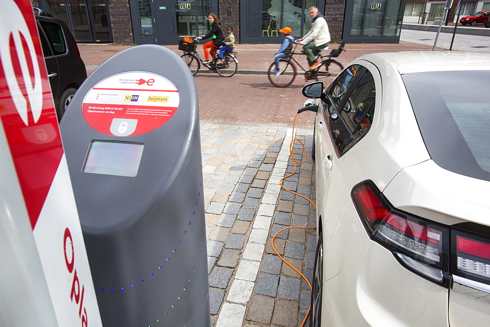 An Ampera electric car at a charging station for electric cars in Ijburg, Amsterdam, Netherlands, Europe