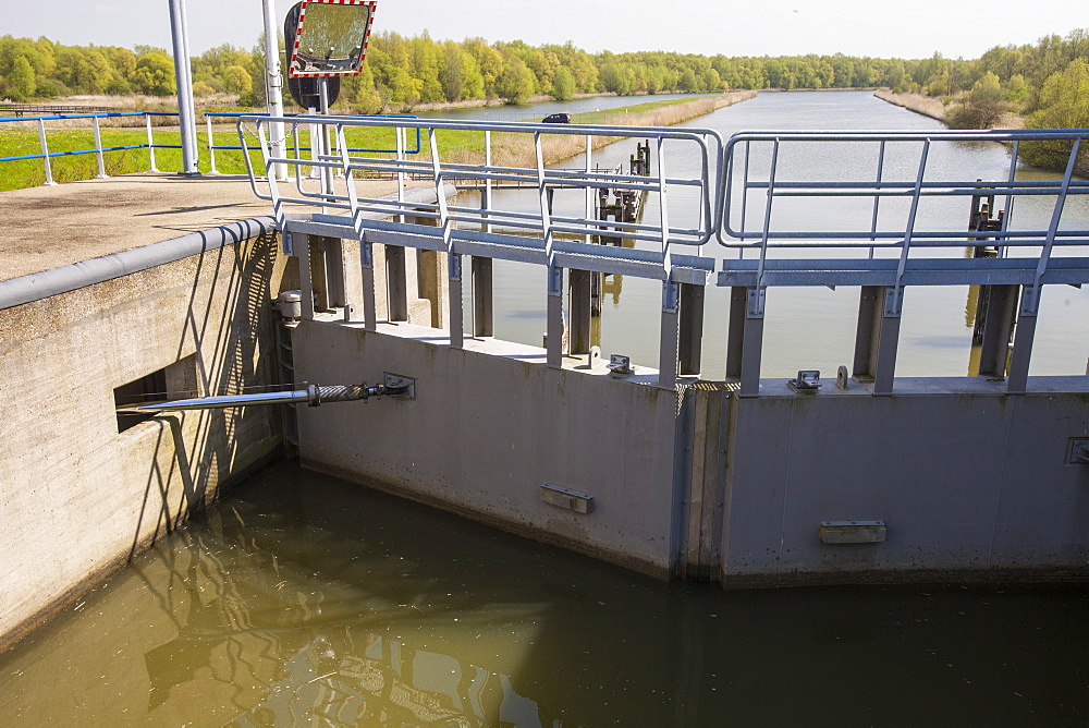 A canal going from the sea to the reclaimed polder land which is some 20 feet lower than the sea, north of Amsterdam, Netherlands, Europe