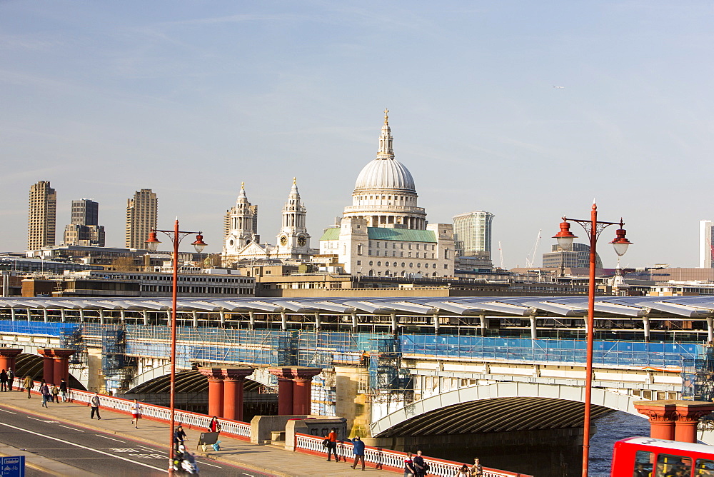 Blackfriars Bridge across the River Thames, the world's largest solar bridge, with St. Paul's Cathedral on the skyline, London, England, United Kingdom, Europe