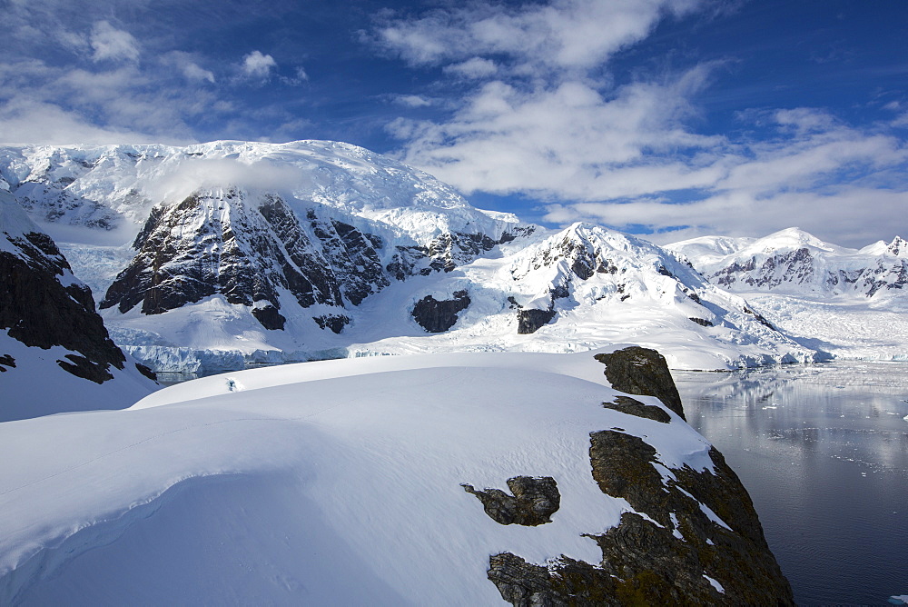 Stunning coastal scenery beneath Mount Walker in Paradise Bay off Graham Land on the Antarctic Peninsular. the Peninsular is one of the most rapidly warming places on the planet.