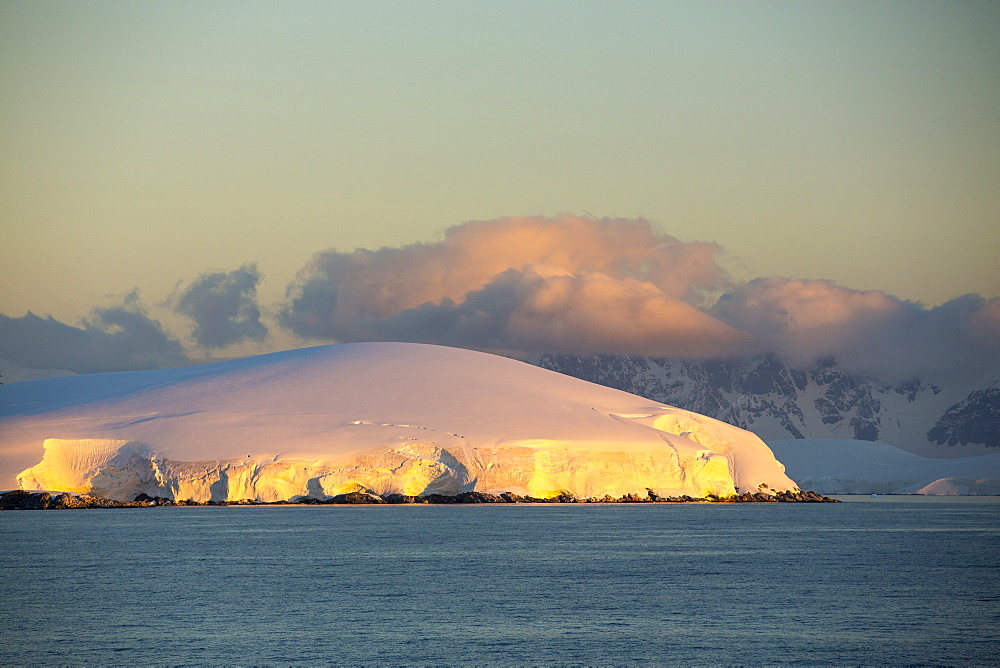 Evening light over mountains from the Gerlache Strait separating the Palmer Archipelago from the Antarctic Peninsular off Anvers Island. The Antartic Peninsular is one of the fastest warming areas of the planet.